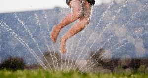 On a hot day, run through the sprinklers
