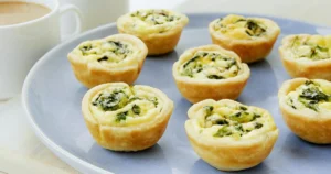Miniature spinach and Cheddar quiche